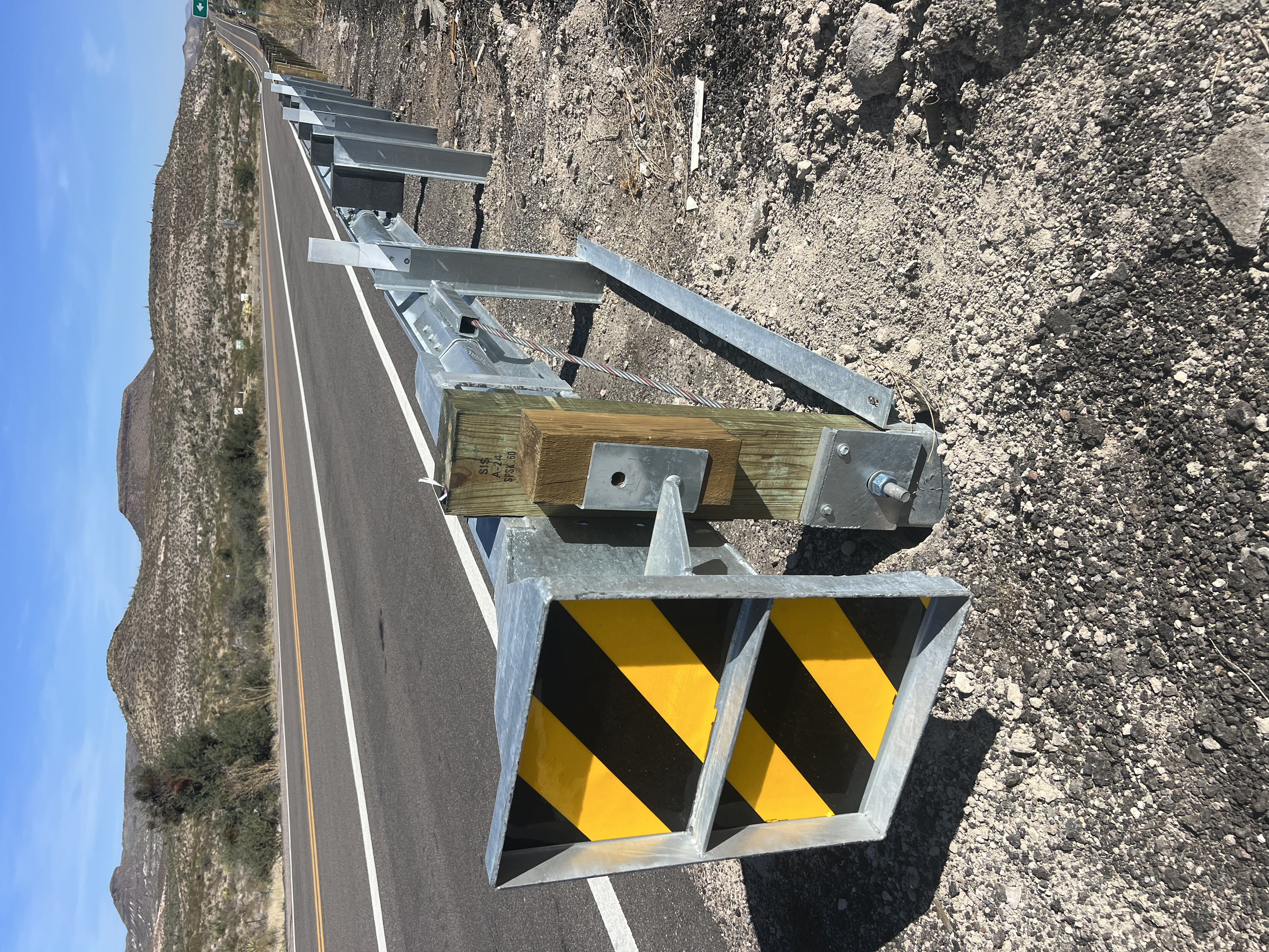 SGET End Terminal installed on mountain highway with W-Beam guardrail