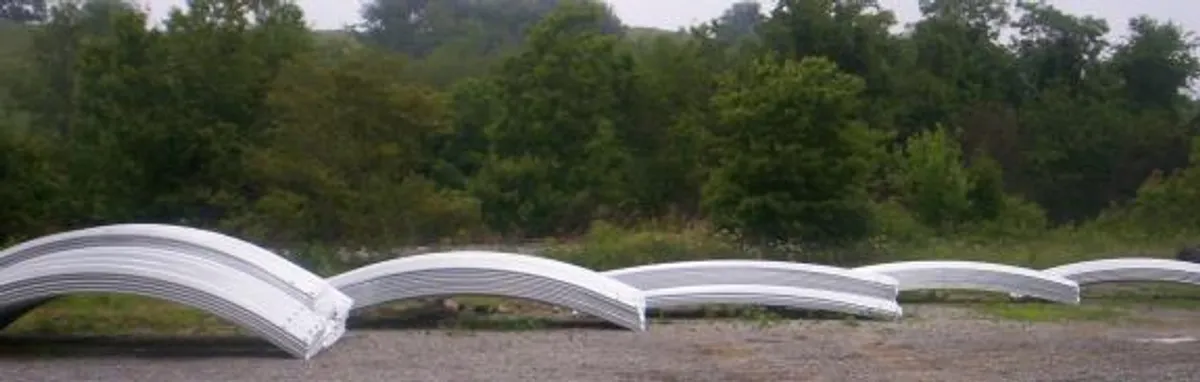 Custom curved guardrail fabricated by SPIG Industry for highway bridge approach